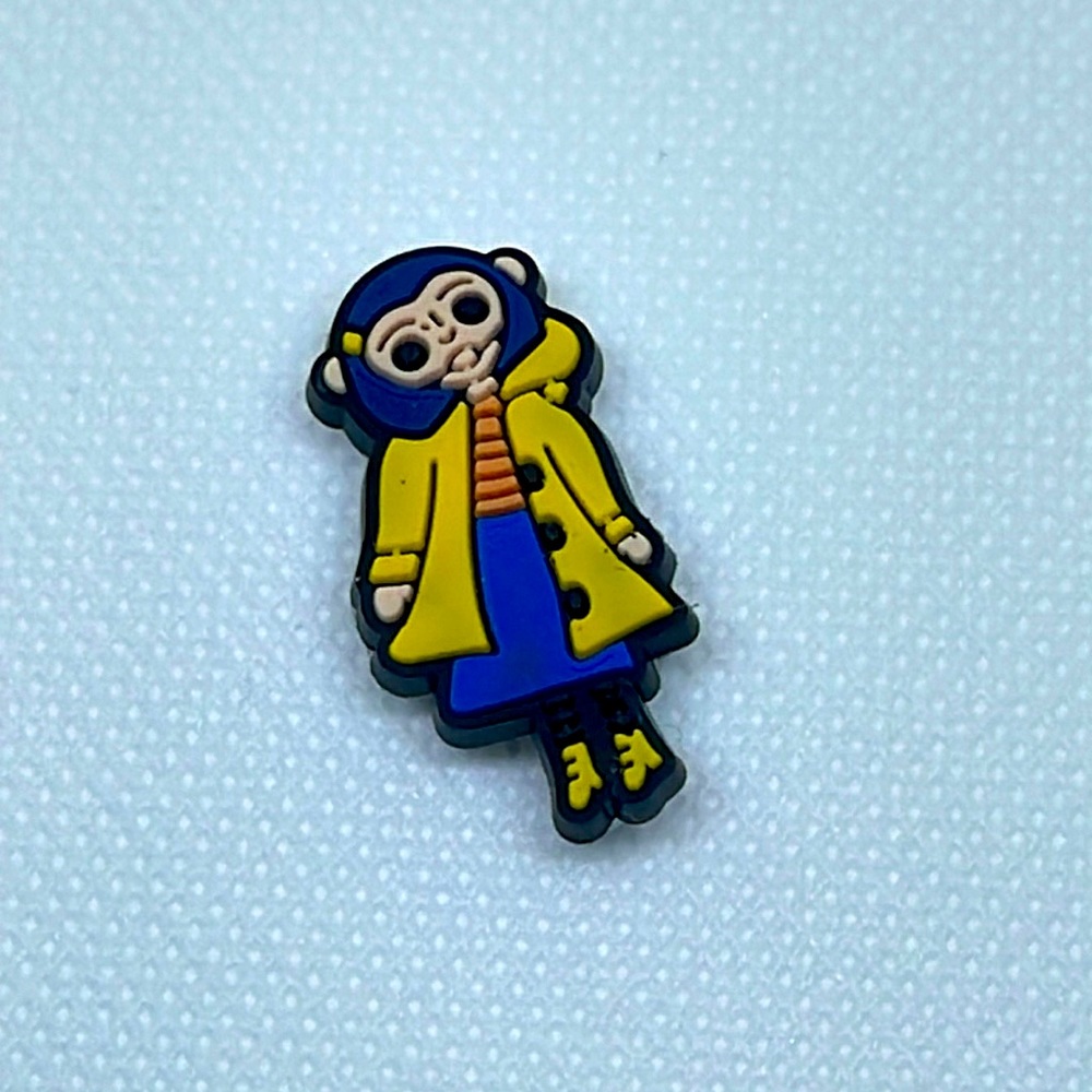 Coraline in a raincoat CROCS charm look alike!